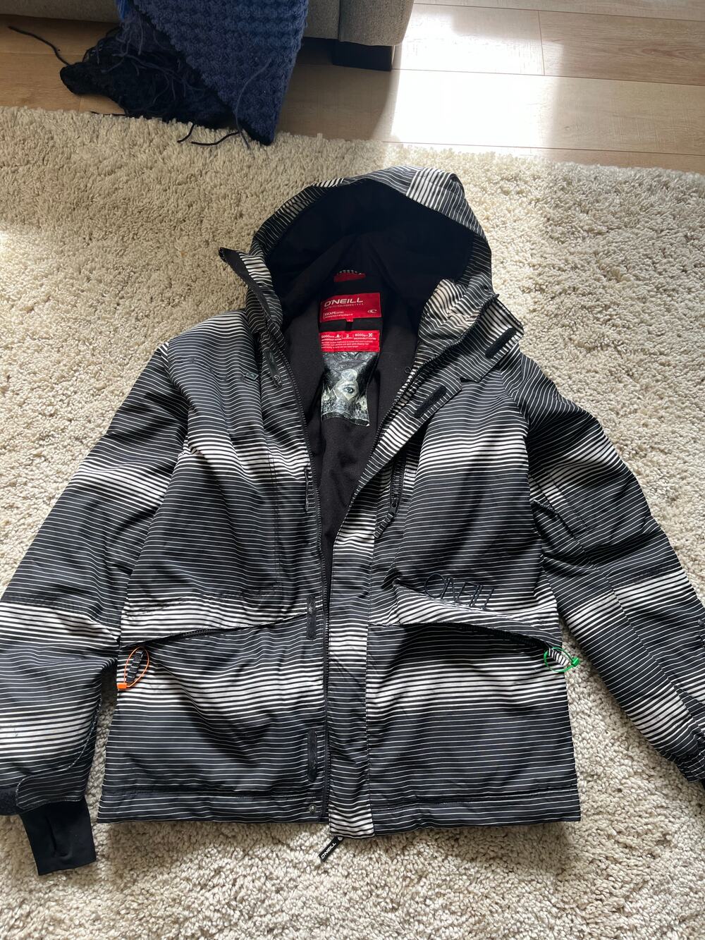 O'Neill striped hooded snow jacket with full zip and multiple zip pockets